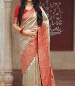 Cream woven banarasi silk saree with blouse