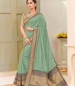   sea green woven silk blend saree with blouse