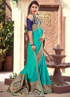   turquoise woven silk blend saree with blouse 1