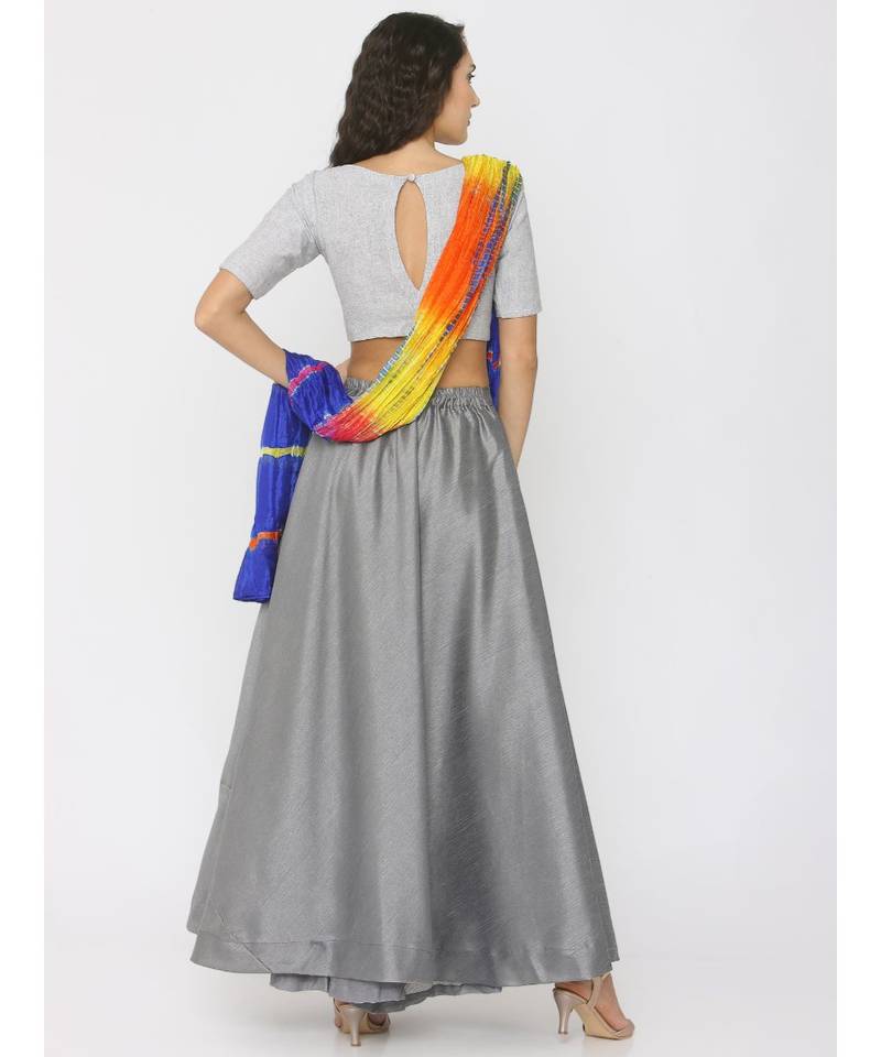 grey lenin blouse paired with silk skirt and blue shibori duppatta