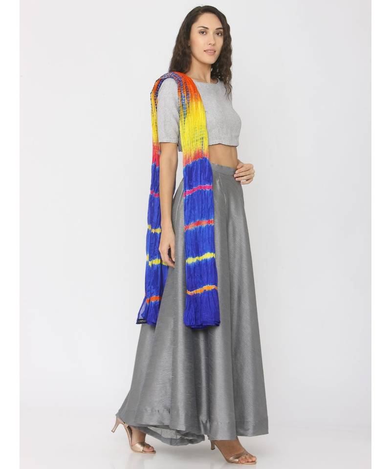 grey lenin blouse paired with silk skirt and blue shibori duppatta