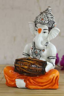 Lord Ganesha playing Dholak
