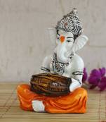 Lord Ganesha playing Dholak
