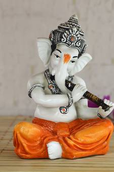 Lord Ganesha playing Flute
