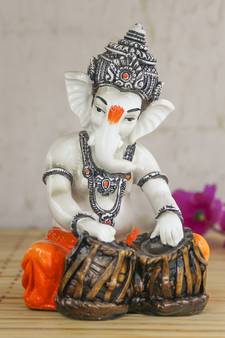 Lord Ganesha playing Tabla