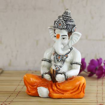 Lord Ganesha playing Manjeera Decorative Showpiece 1