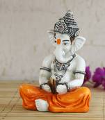 Lord Ganesha playing Manjeera Decorative Showpiece