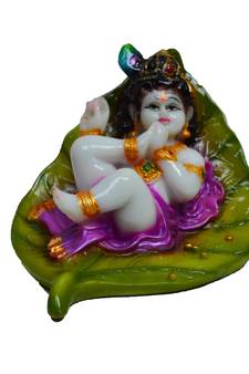 Synthetic Laddu Gopal on Green Leaf