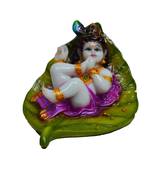 Synthetic Laddu Gopal on Green Leaf