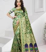 green woven banarasi saree with blouse
