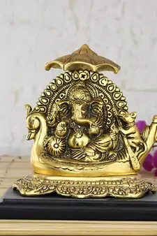 Golden Lord Ganesha sitting on Swan Throne