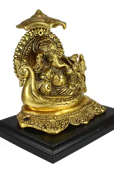 Golden Lord Ganesha sitting on Swan Throne