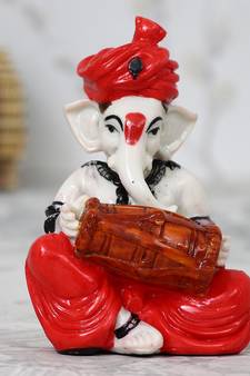 Lord Ganesha playing Dholak
