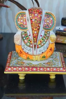 Lord Ganesha on Floral Designed Marble Chowki