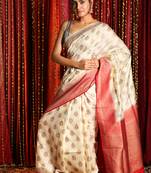 Off white woven banarasi saree with blouse