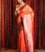 Orange woven tussar silk saree with blouse
