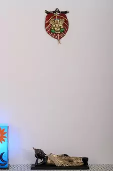 Lord Ganesha in Green Dhoti on Red Leaf Wall Hanging