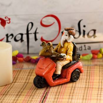 ganesh on scooter figurine 1