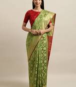 Green woven silk blend saree with blouse