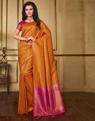 Orange woven silk blend saree with blouse 1