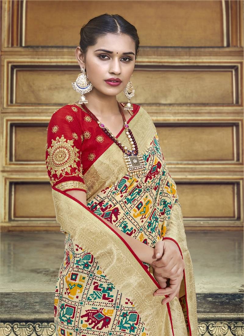 Cream embroidered patola saree with blouse