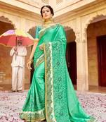   sea green embroidered fancy fabric saree with blouse