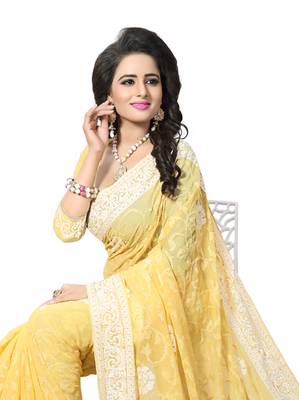 Yellow embroidered georgette saree with blouse 3