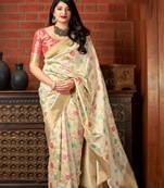 Cream woven banarasi silk saree with blouse