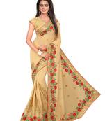 Beige embroidered georgette saree with blouse