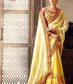 yellow embroidered georgette saree with blouse