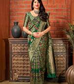 Green woven banarasi silk saree with blouse