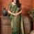 Dark green woven banarasi silk saree with blouse