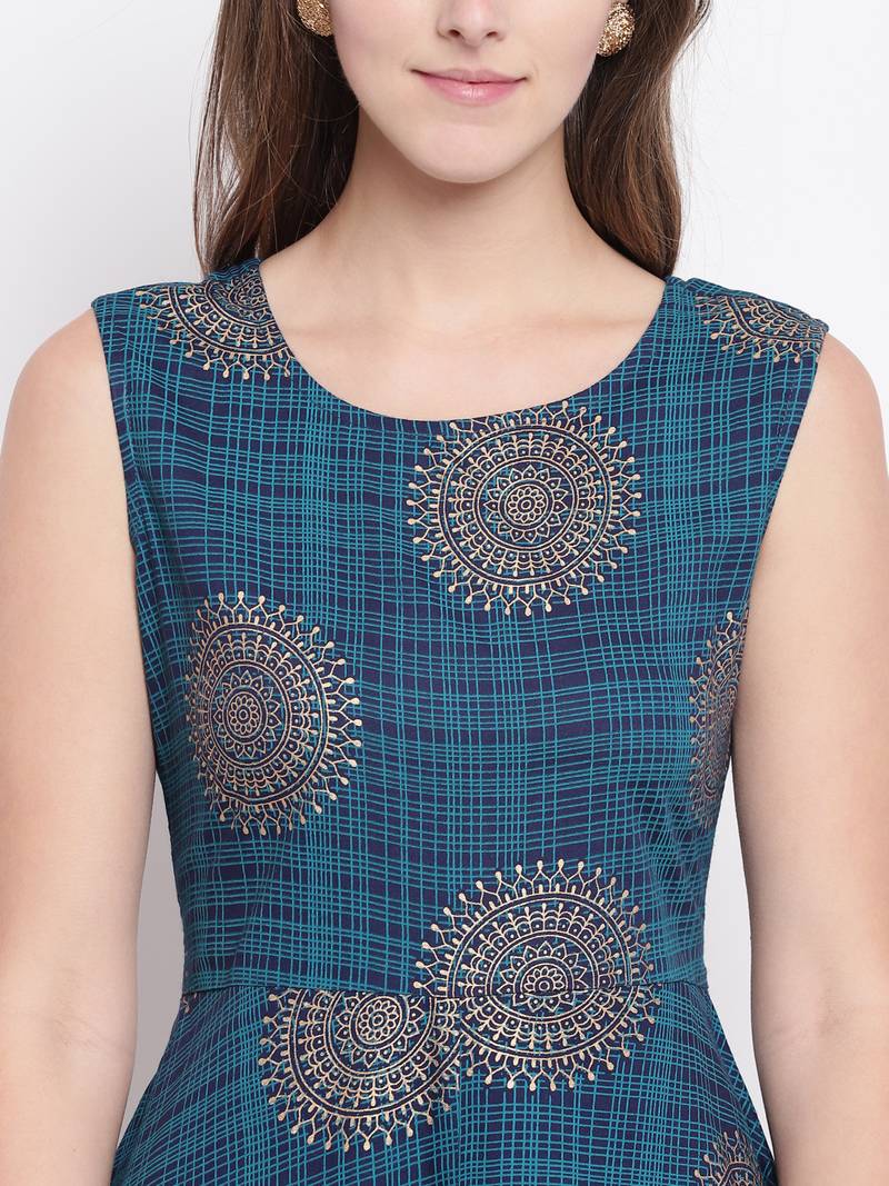 Flared blue kurti palazzo set with attatched sleeves decorated with gold motifs all over.