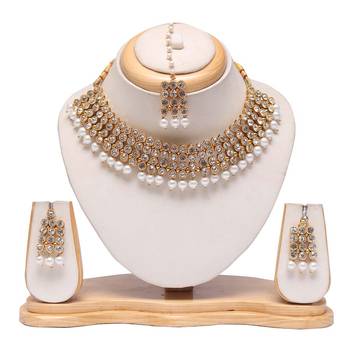 Beautiful white stone and pearl emebellished raani haar with earrings and maang tikka 1