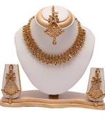 Golden choker necklace set with maang tikka
