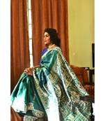 Royal, majestic Baluchari saree in a dual tone of blue-green