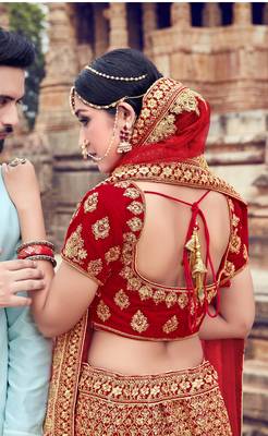 Red embroidered velvet semi stitched lehenga 2