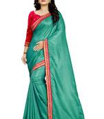 Turquoise embroidered raw silk saree with blouse