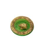 Tortoise incense holder placed in Green glass vessel with metal border