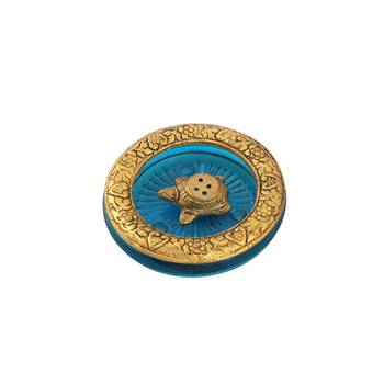 Tortoise incense holder placed in Turquoise glass vessel with metal border 1