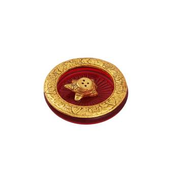 Tortoise incense holder placed in Red glass vessel with metal border 1