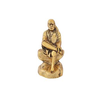 Sai baba seated on a rock in metal antique gold plated 1