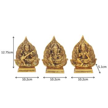 Lakshmi ji Ganesh ji and saraswati ji with leaf backdrop in metal antique golden finish 2
