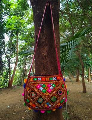 Real Mirror Worked Matka Shaped Kutch Embroidered Banjara Jhola Bag With Multicolored Pompoms All Around 1