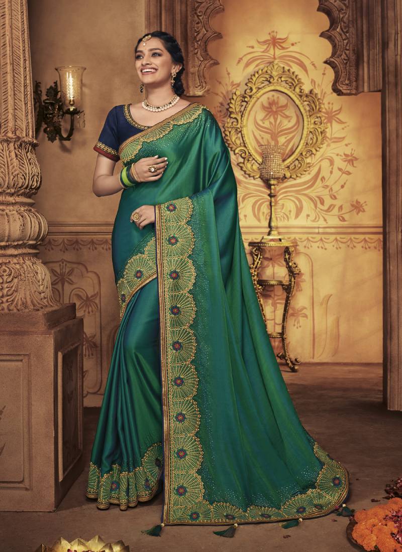   dark green embroidered silk saree with blouse