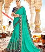 Turquoise Embroidered Georgette Saree With Blouse