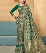 Green woven art silk saree with blouse