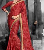 Dark red woven chiffon saree with blouse
