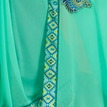Turquoise embroidered georgette saree with blouse 4