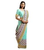 Green woven silk blend saree with blouse